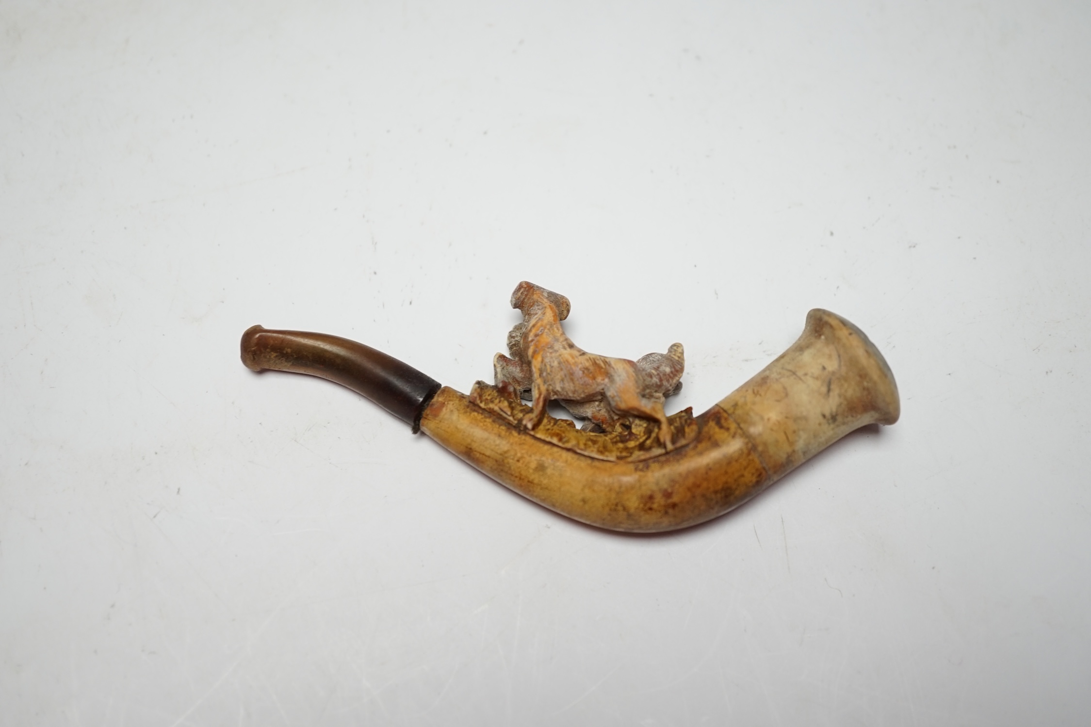 A meerschaum pipe carved with two dogs, cased, 11cm wide